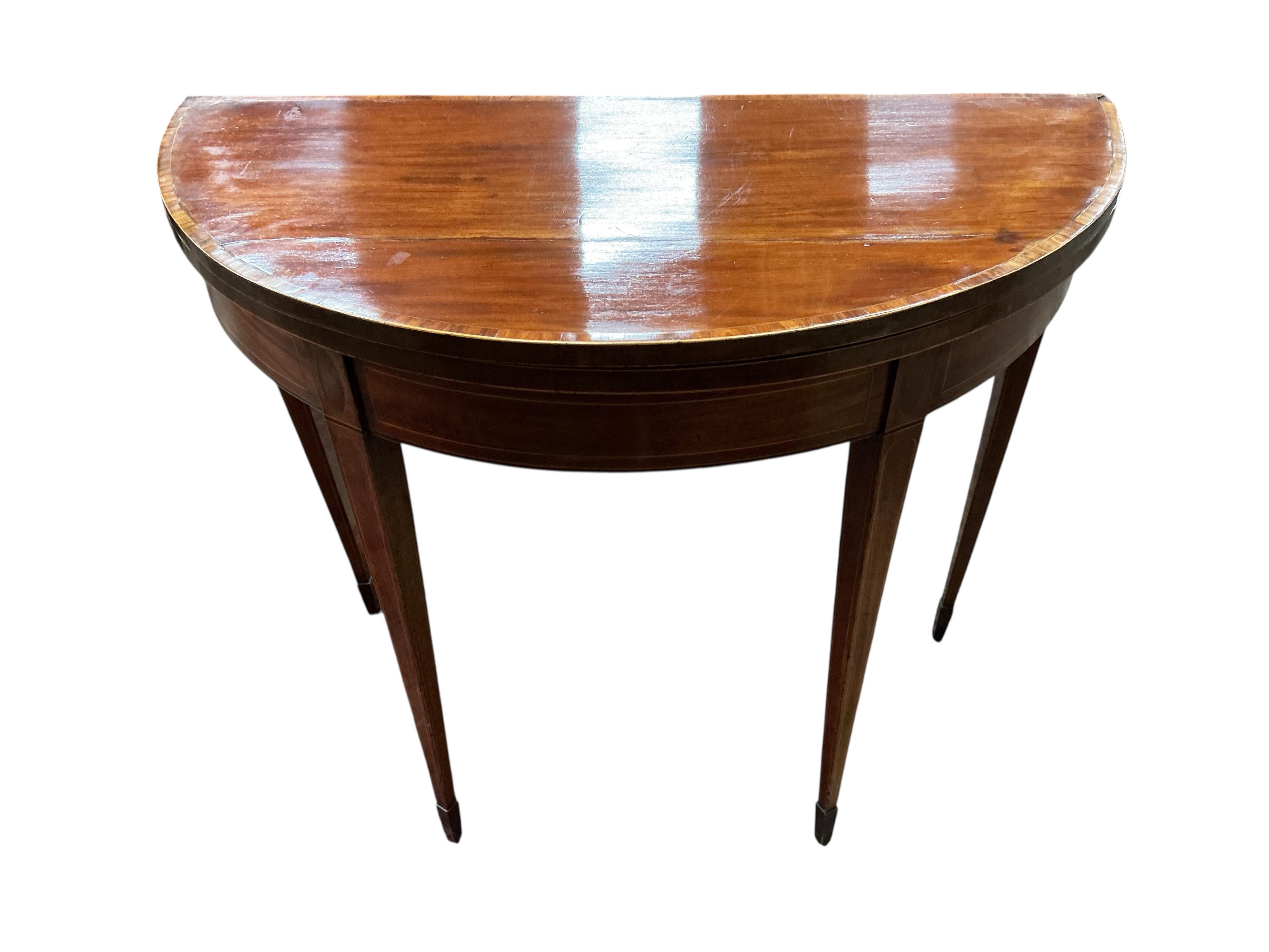 A George III tulip banded mahogany demi-lune folding card table, width 91cm, depth 45cm, height 74cm
